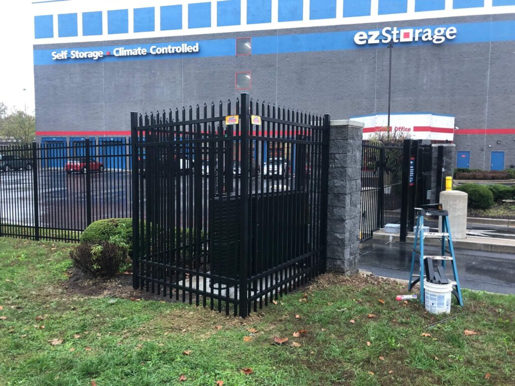 a black fence is in front of a building